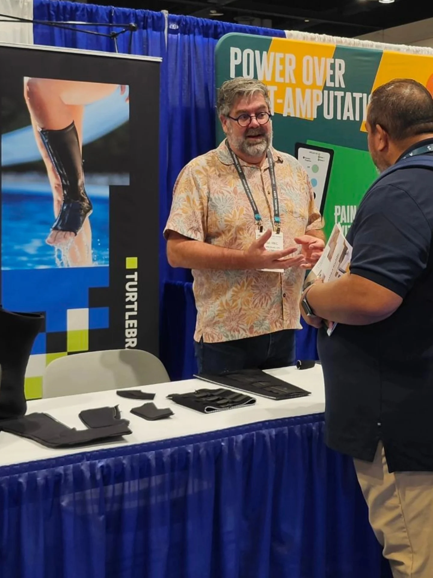 Clinicians examining traditional vs modern remoldable orthotic devices in innovation lab setting