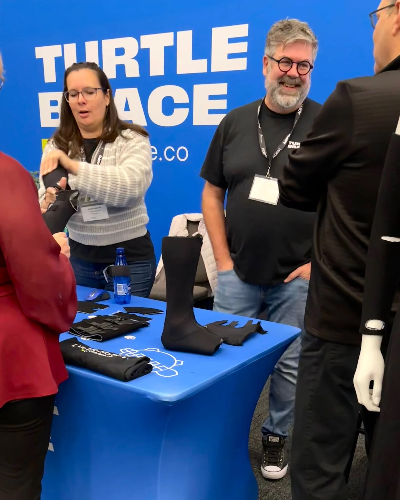 Attendees at APTA convention experiencing Turtlebrace orthotic devices in interactive exhibit booth