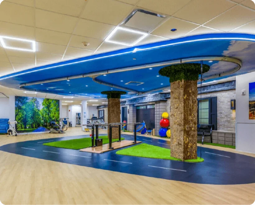 solo-step fall protection system integrated into rehabilitation clinic ceiling ensuring patient safety during mobility exercises