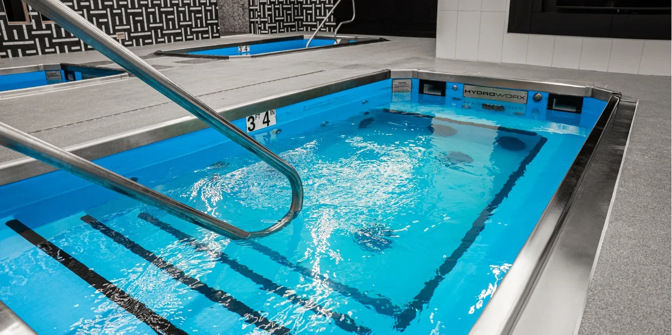 HydroWorx consultant meeting with clinic owner discussing aquatic therapy solutions