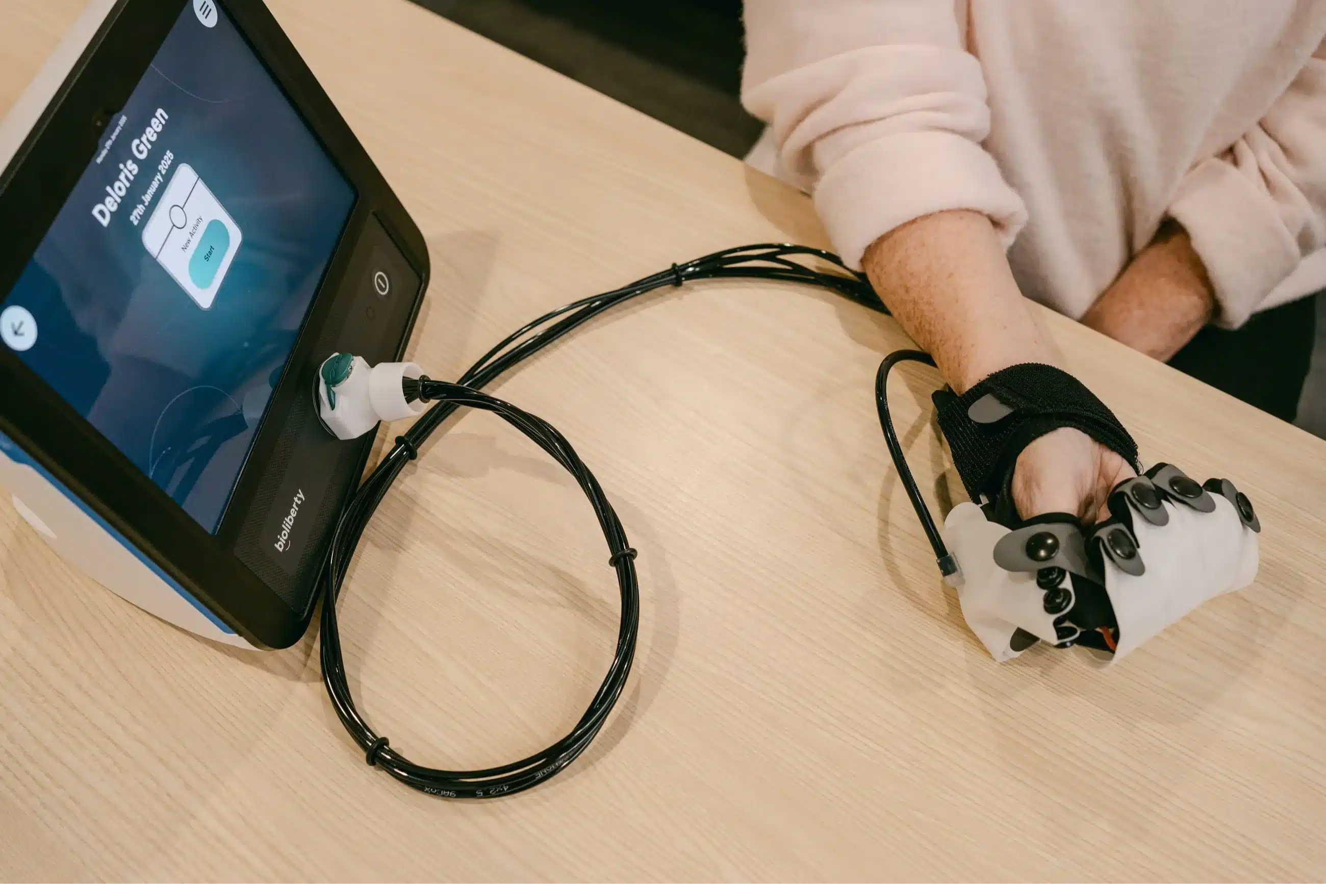 Therapists using wearable robotic devices with patients in a collaborative clinical rehab environment